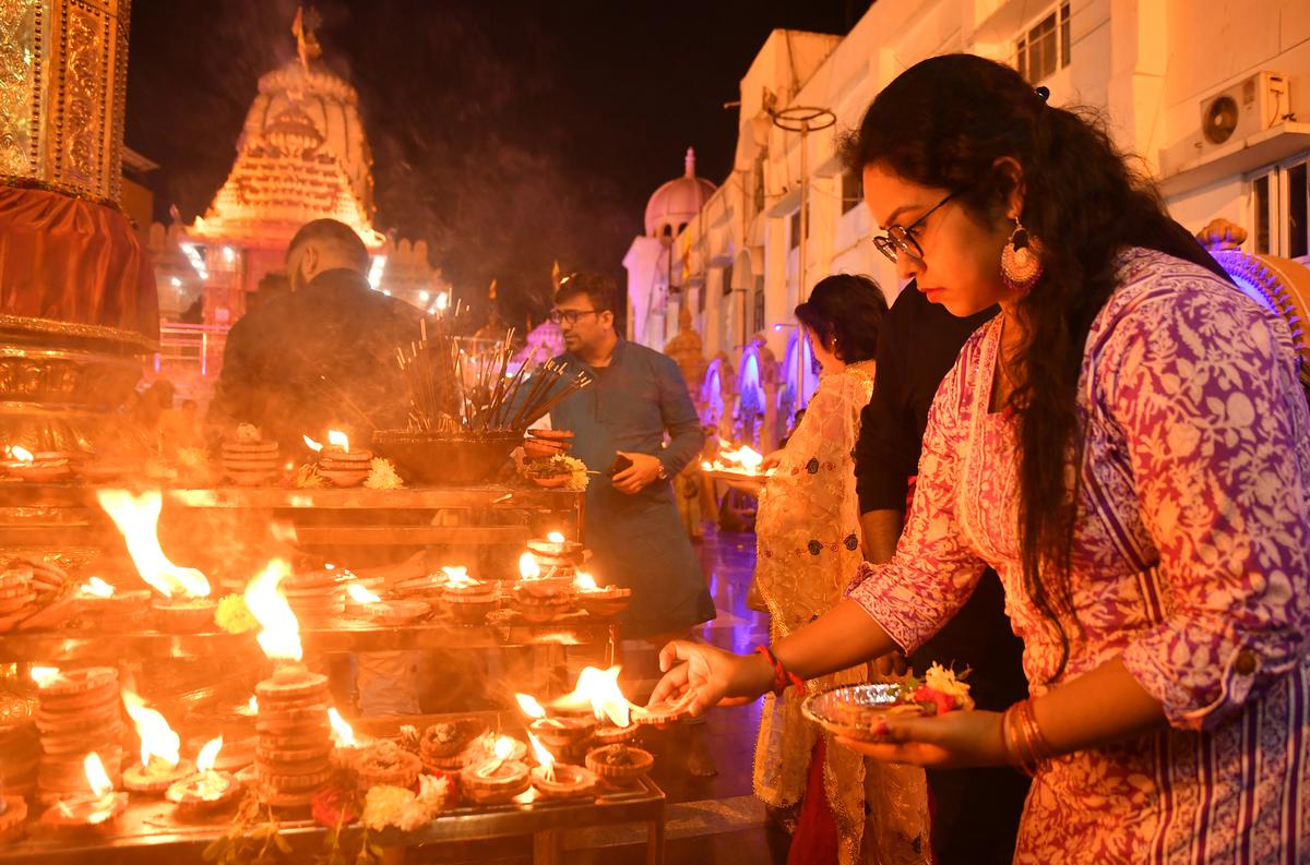 Devotees performing puja at a temple in Hyderabad. 