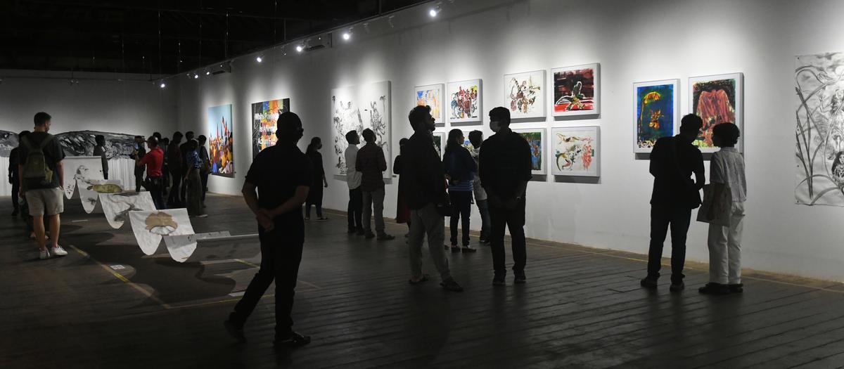 Visitors flock an exhibition as part of the Kochi Muziris Biennale, in April 2023.