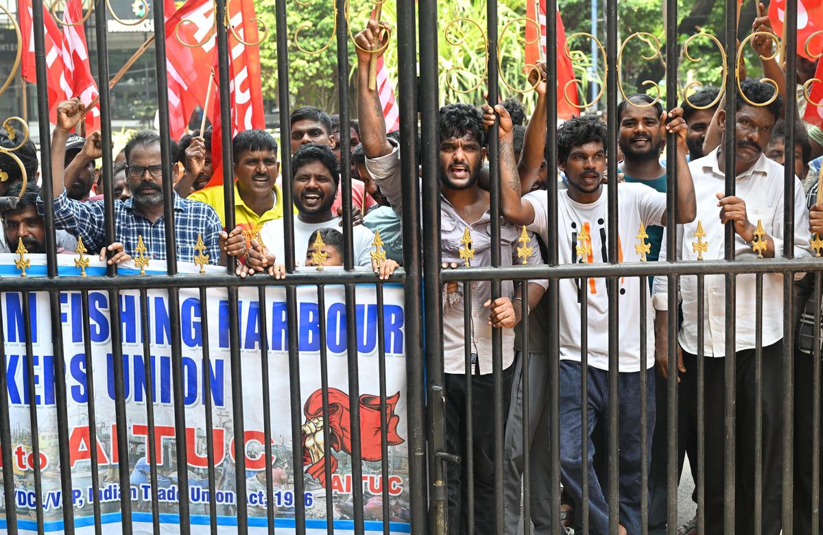 Members of the Visakhapatnam Fishing Harbour Workers Union affiliated to AITUC staging a protest in front of the Collectorate in Visakhapatnam on Monday over alleged irregularities in the disbursal of Matsyakarula Sevalo assistance to fishermen.