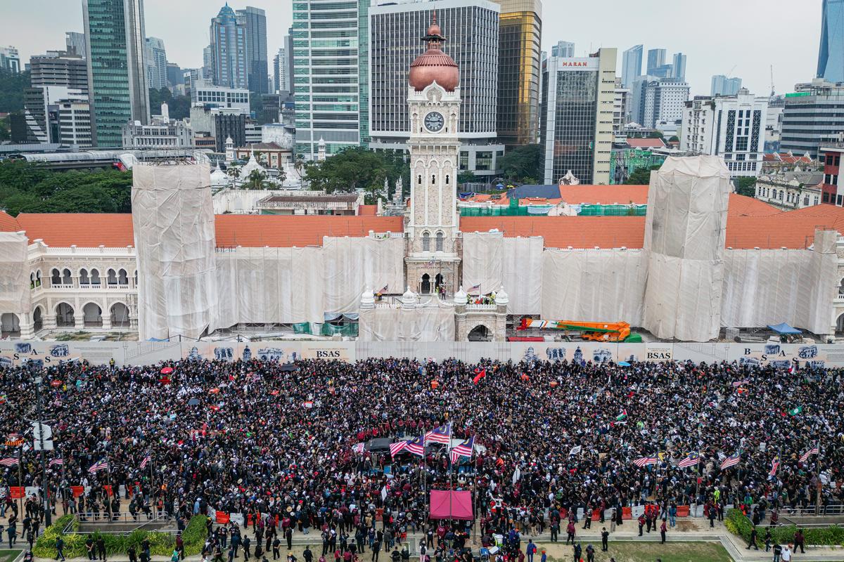 People gather to protest during a demonstration calling for the resignation of Malaysia’s Prime Minister Anwar Ibrahim at Merdeka Square on July 26, 2025 in Kuala Lumpur, Malaysia. The “Turun Anwar” (Anwar Resign) rally, held in downtown Kuala Lumpur, demands Anwar’s resignation over economic and political grievances, fueled by growing public discontent over rising living costs and a perceived lack of reform by his unity government. The opposition coalition reportedly organises the protest at Dataran Merdeka.