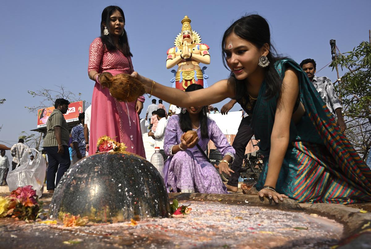 Devotees offer prayers on the occasion of Maha Shivratri at the Sri Rama Lingeshwara Swamy temple, Keesaragutta, in Medchal-Malkajgiri district, on Wednesday. 