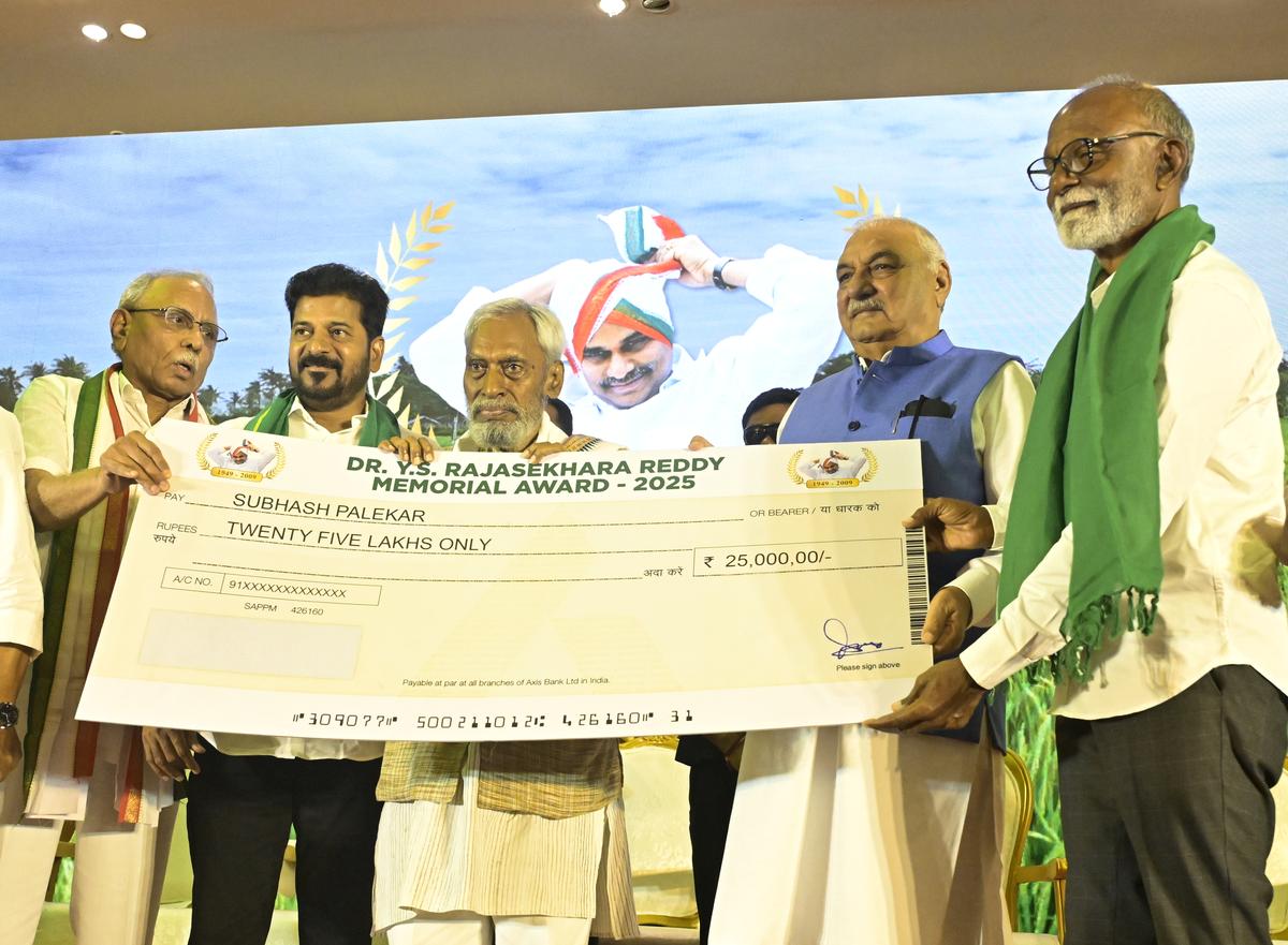 Telangana CM A. Revanth Reddy along with former Haryana CM Bhupinder Singh Hooda giving the Y.S. Rajasekhara Reddy Memorial award 2025 to Subhash Palekar in Hyderabad on Tuesday.