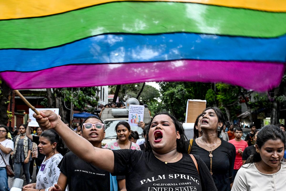 Activists and supporters of the LGBTQ community wave pride flags and raise slogans during a protest march to condemn the rape and murder of a doctor in Kolkata on September 1, 2024.