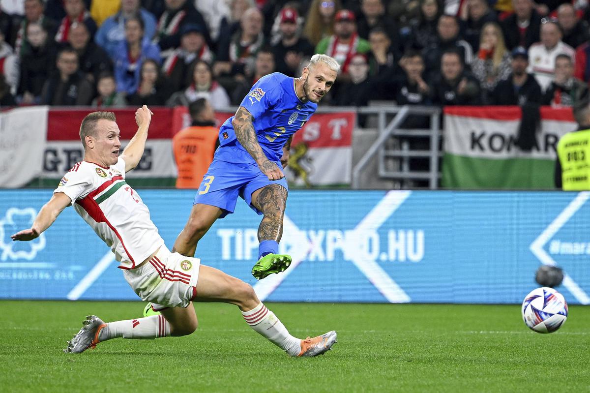 Italy’s goalscrorer Federico Dimarco, right, in action against Hungary’s Adam Lang, left, during the UEFA Nations League match between Hungary and Italy, at the Puskas Arena in Budapest, Hungar on September 26, 2022