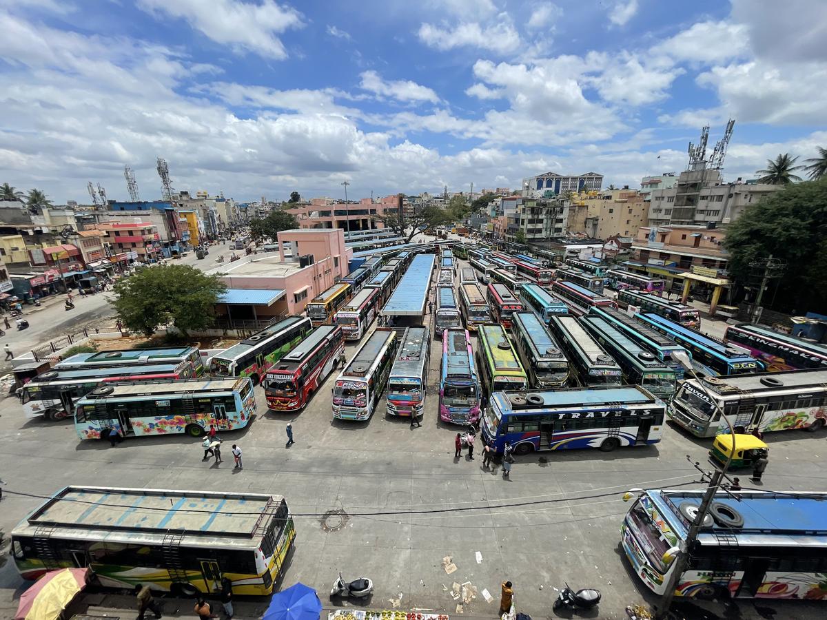 Private buses parked at the Kalasipalya bus stand in Bengaluru on Monday.