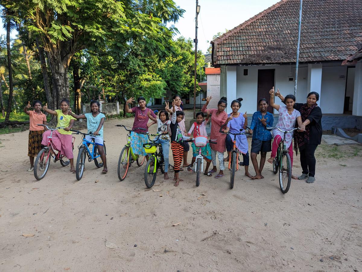 Students of Sri Chitra Home learning to ride a bicycle. 