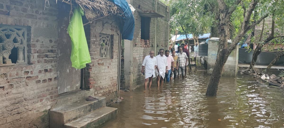 Members of CPI(M) visited T.Manalmedu, a rain water stagnated village on Monday Members of CPI(M) visited T.Manalmedu, a rain water stagnated village on Monday