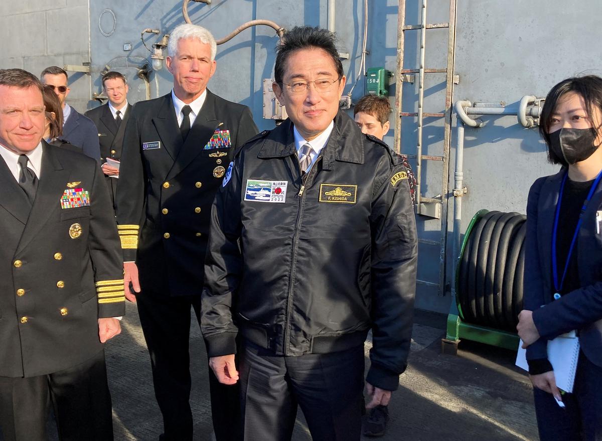 Japan PM vows to strengthen military at international naval review