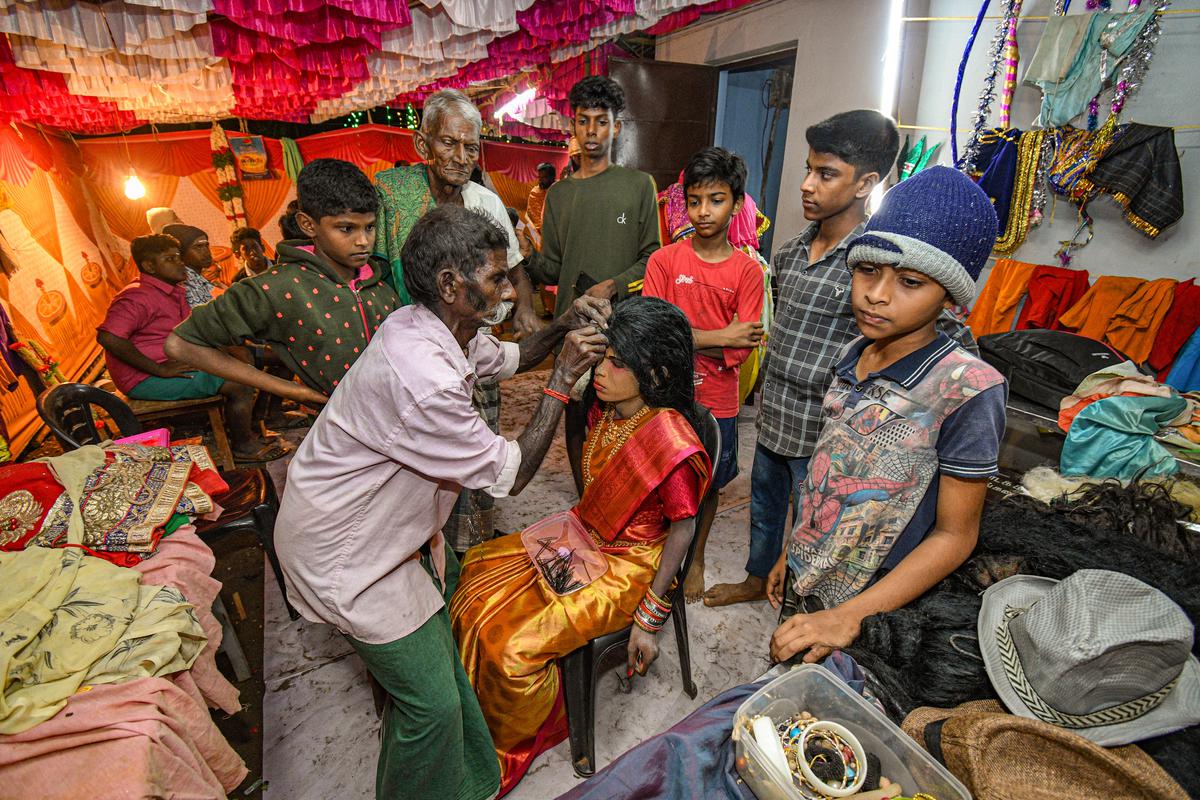 A male artiste gets ready to play a female character at Kasavalanadu Kollangarai village near Thanjavur.