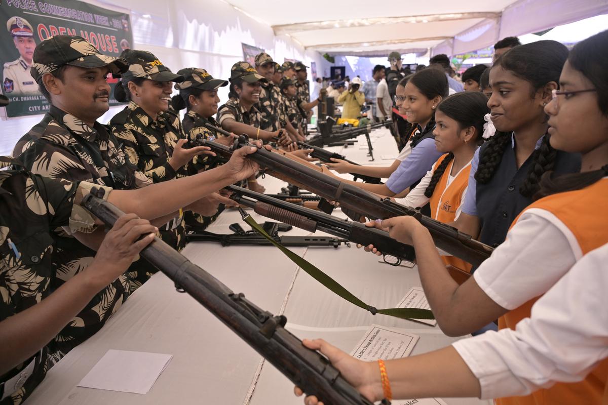 Police personnel explaining about weapons to students during the ‘Open House’ programme in Vijayawada on Saturday. 