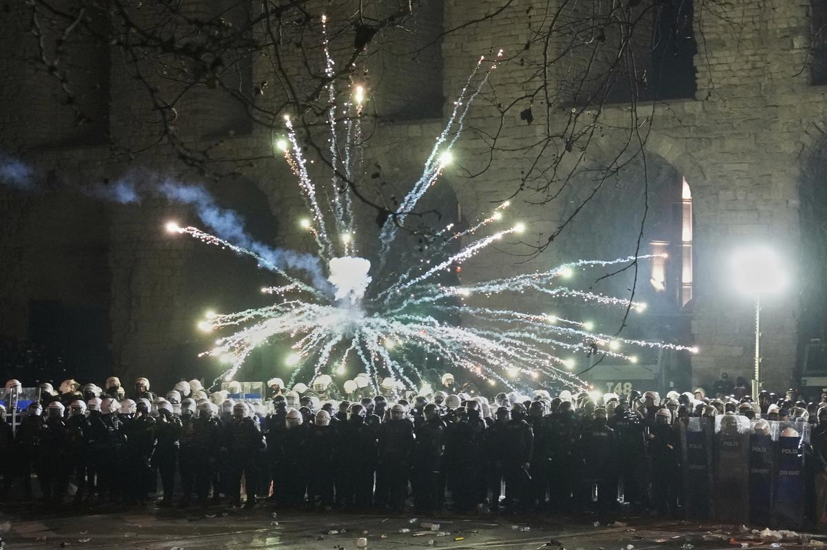 Fireworks thrown by protesters explode over riot police during a protest against the arrest of Istanbul’s Mayor Ekrem Imamoglu, in Istanbul, Turkey, on March 22, 2025. Fireworks thrown by protesters explode over riot police during a protest against the arrest of Istanbul’s Mayor Ekrem Imamoglu, in Istanbul, Turkey, on March 22, 2025.