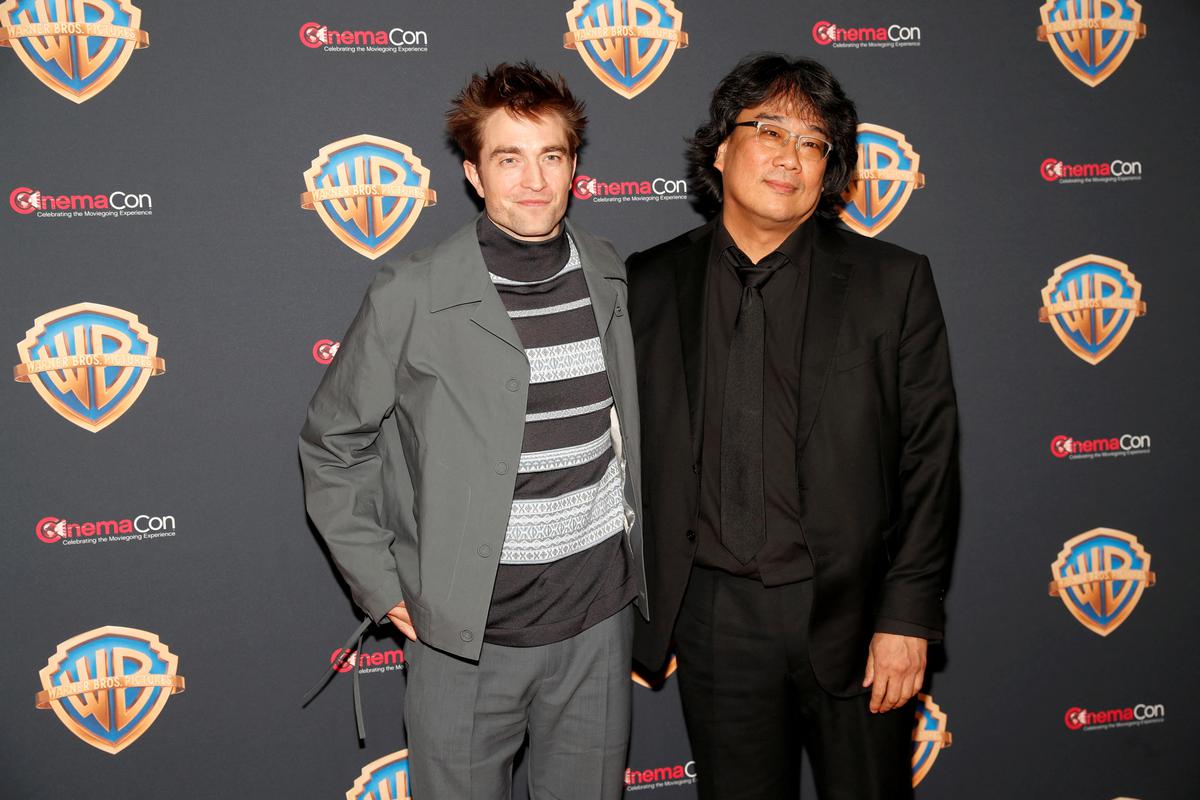 Actor Robert Pattinson and director, producer and writer Bong Joon Ho, promoting the film ‘Mickey 17’, pose on the red carpet during a Warner Bros. presentation at CinemaCon