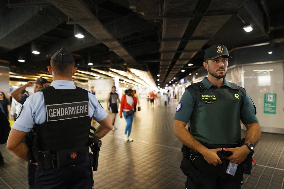 Spanish police and French gendarmerie are pictured at the Chatelet Les Halles train station, ahead of the Paris 2024 Olympics 