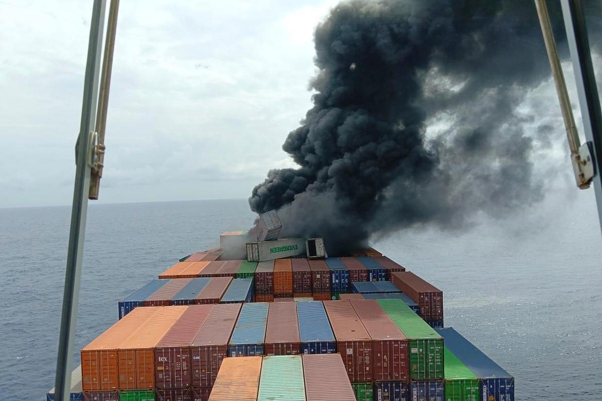In this photo released by Indian Coast Guard, smoke rises following an explosion and fire onboard the Singapore-flagged container ship. In this photo released by Indian Coast Guard, smoke rises following an explosion and fire onboard the Singapore-flagged container ship.