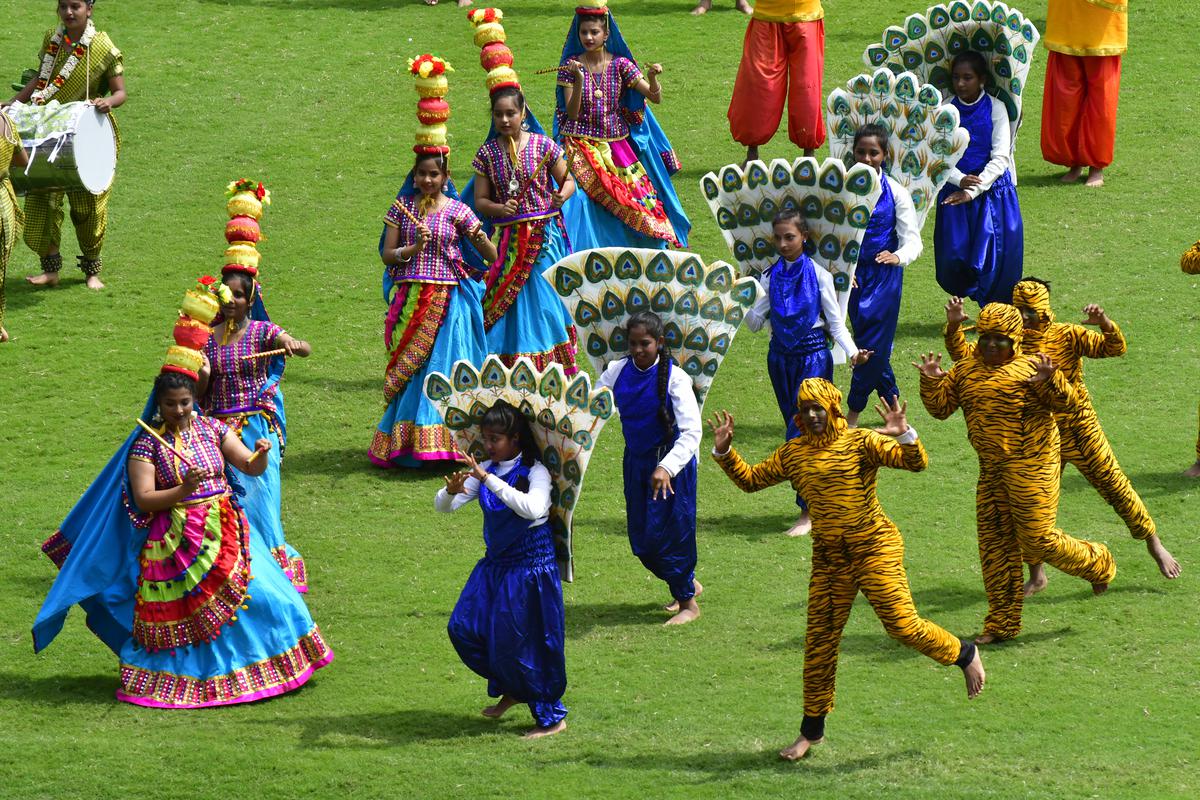 Students take part in the cultural event during the Kannada Rajyotsava celebrations, at the Kanteerava Stadium in Bengaluru on November 01, 2023.