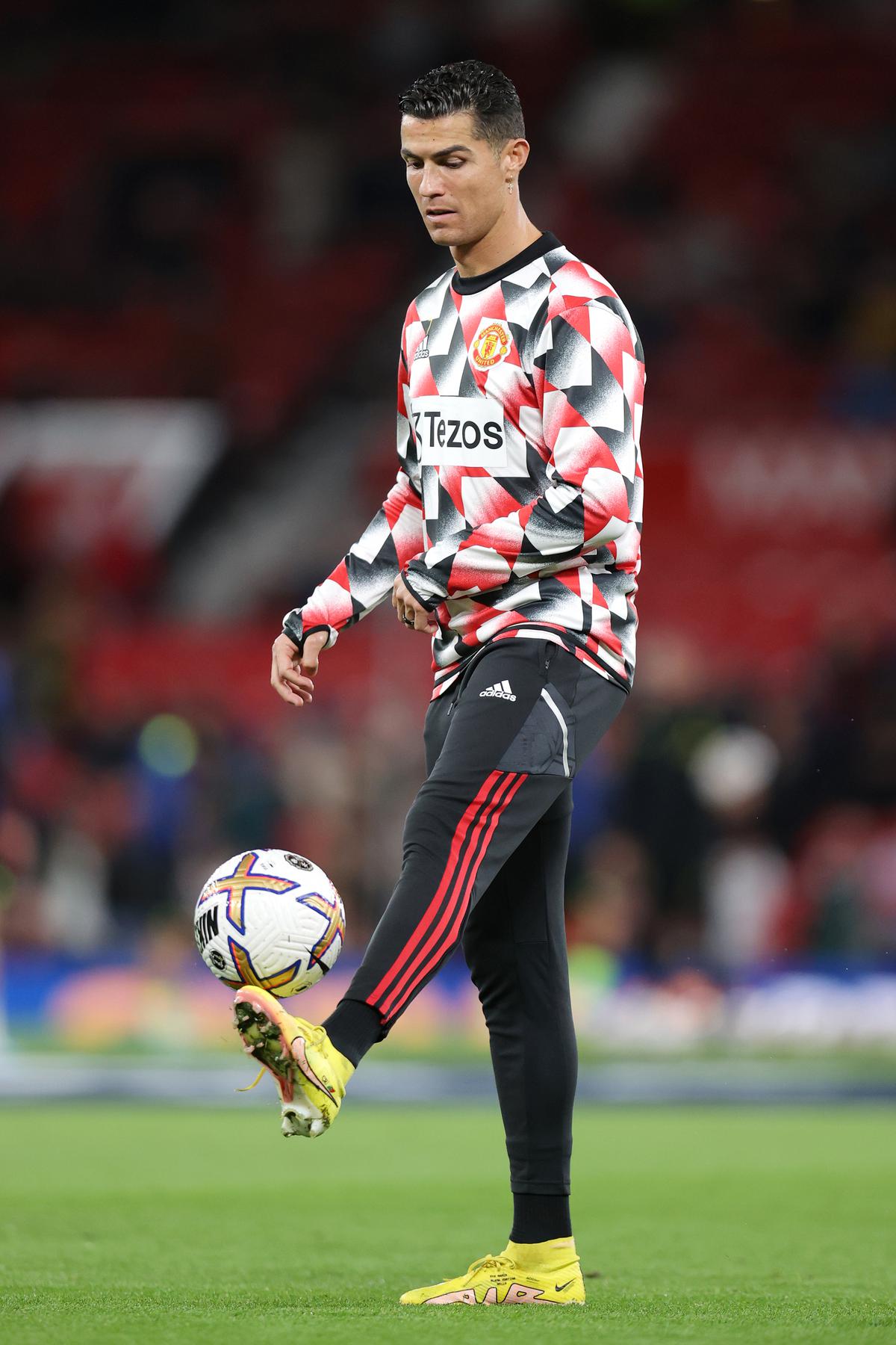 Cristiano Ronaldo of Manchester United warms up prior to the Premier League match against Tottenham Hotspur at Old Trafford