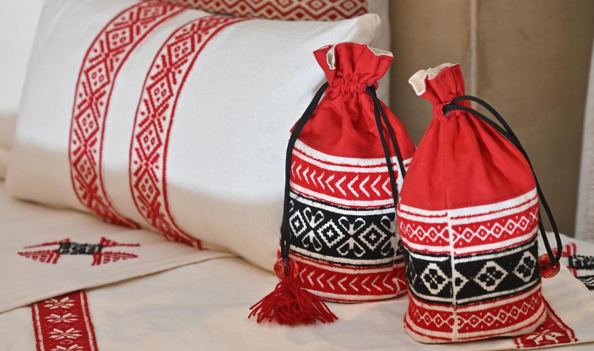 Cushion covers and potli bags with Toda embroidery 