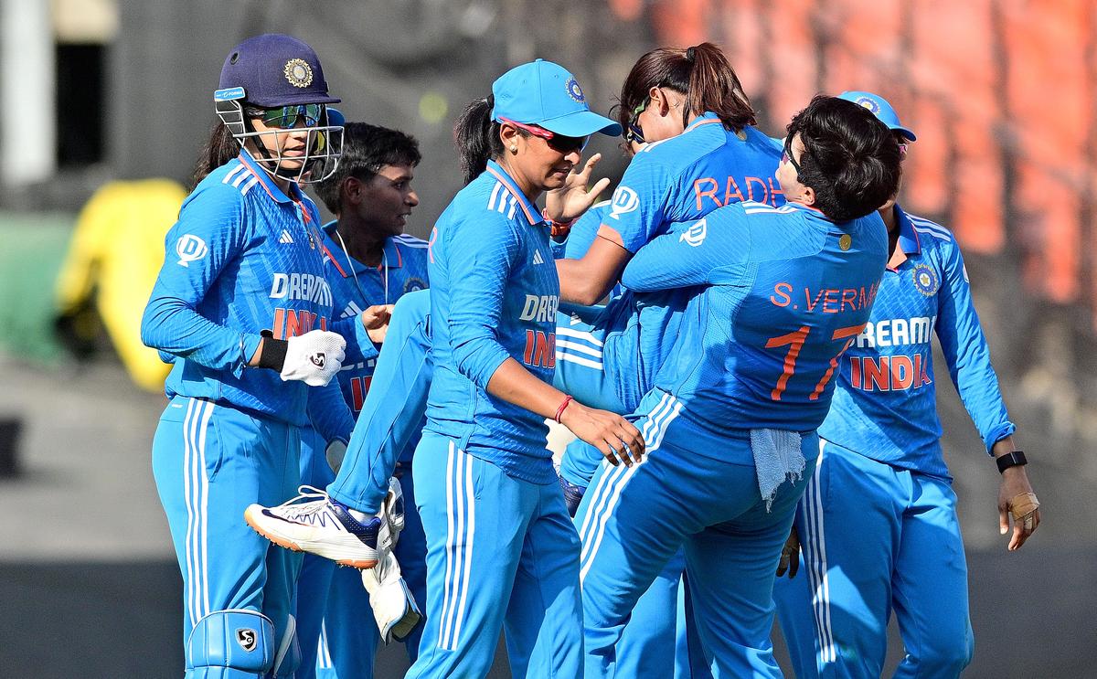 Radha Yadav celebrates with her teammates after taking a wicket during the second ODI against New Zealand women in Ahmedabad on October 27, 2024.