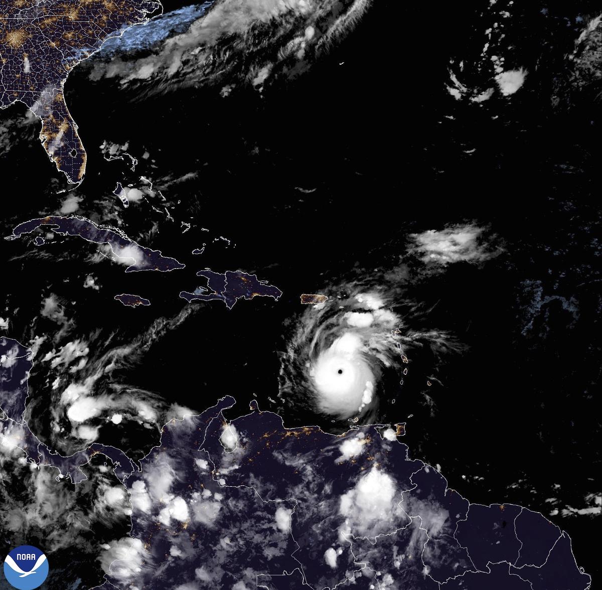 This National Oceanic and Atmospheric Administration satellite image taken at 10:50pm EDT shows hurricane Beryl, center, as it moves across the Caribbean on Monday, July 1, 2024. Hurricane Beryl has strengthened to Category 5 status as it crossed islands in the southeastern Caribbean. 