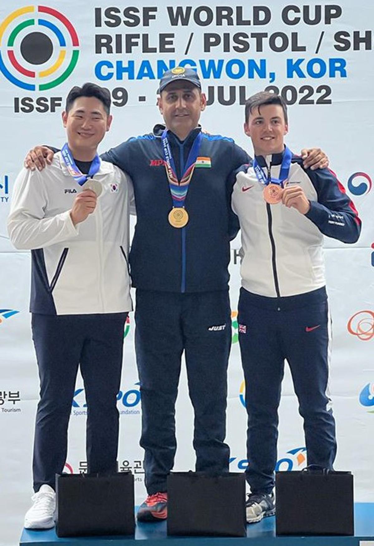 Kim Minsu, champion Mairaj Ahmad Khan and Ben Llewellin, with the skeet medals in the World Cup in Changwon, Korea, on July 18, 2022. 