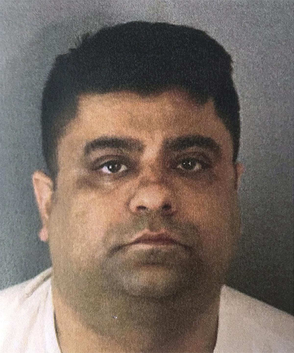 This booking photo released by the Riverside County Sheriff’s Department shows Anurag Chandra, 42 of Corona, California, Monday, Jan. 20, 2020. 