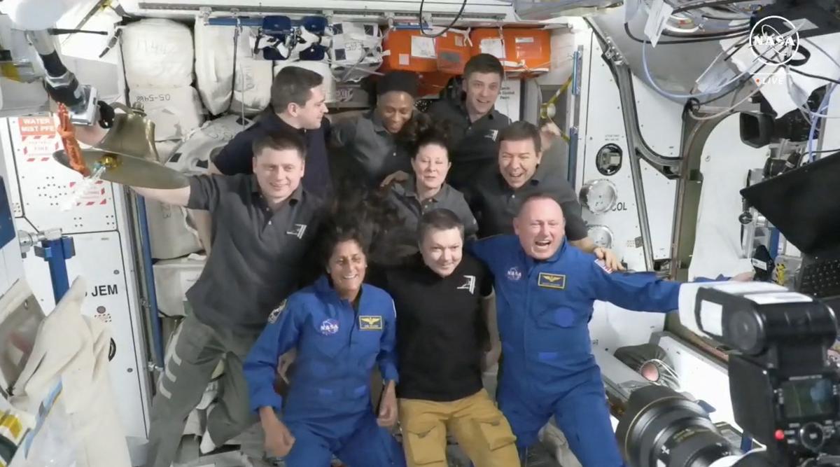 This screengrab from NASA shows astronaut Sunita Williams (seated L) and Butch Wilmore (seated R) posing with the crew of the International Space Station (ISS) after the docking of the Boeing Starliner on June 6, 2024. 
