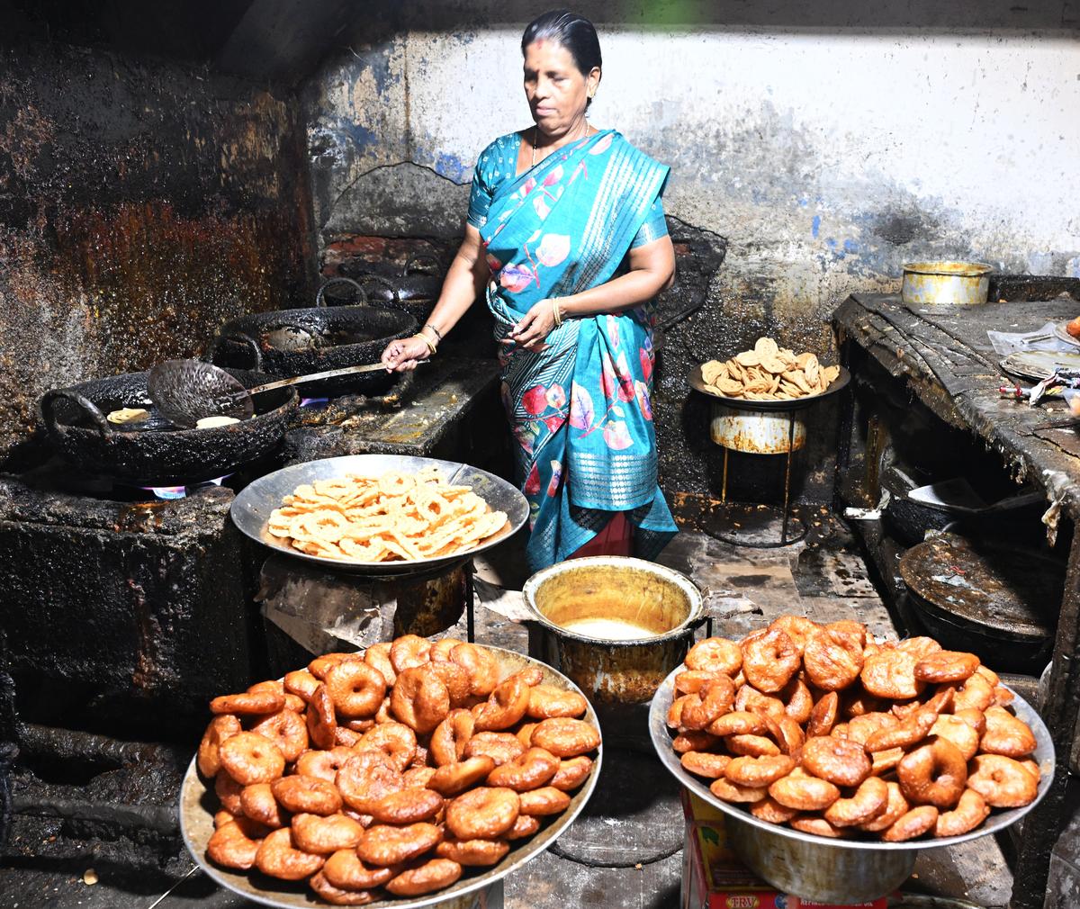 One of the women at Sumangali Home Industry, prepares and arranges batches of athirasams in Madurai. One of the women at Sumangali Home Industry, prepares and arranges batches of athirasams in Madurai.
