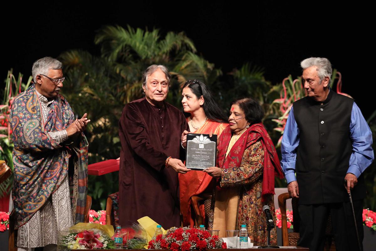 Shobha Deepak Singh receiving the Sumitra Charat Ram Lifetime Achievement Award-2023 from Ustad Amjad Ali Khan in Delhi. Also seen in the picture, her husband Deepak Singh (extreme right) and diplomat Pawan K Varma (extreme left)