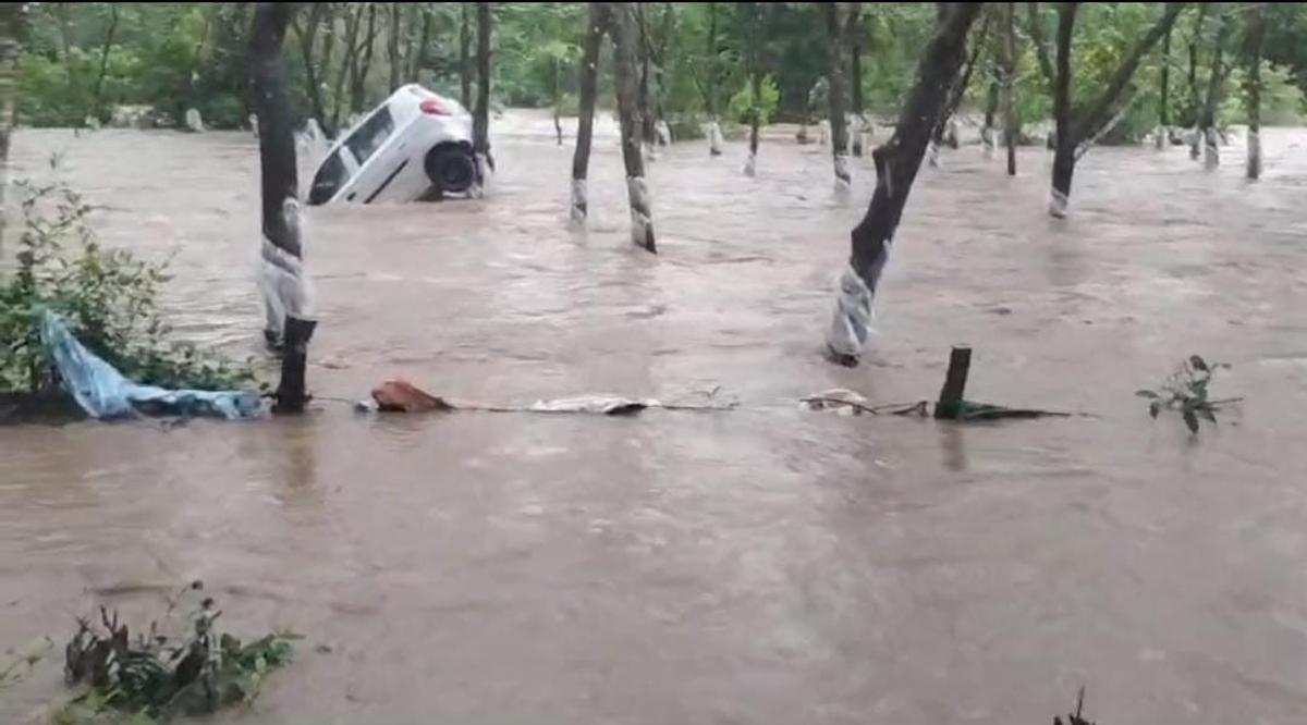 A car was washed away due to heavy rains in Mudradi area.