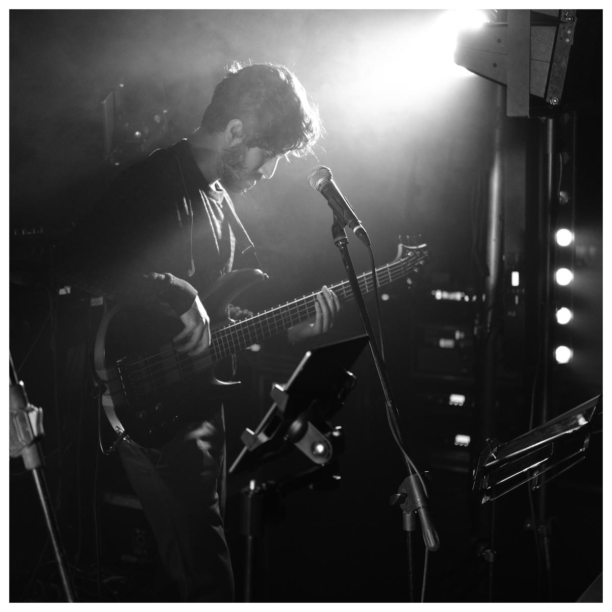 Bass guitarist ⁠Vijit Singh performing at a show 