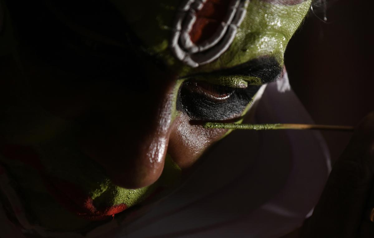 Margi Sajeev applying make up before a performance at Ammannur Chachu Chakyar Gurukulam, Irinjalakuda 
