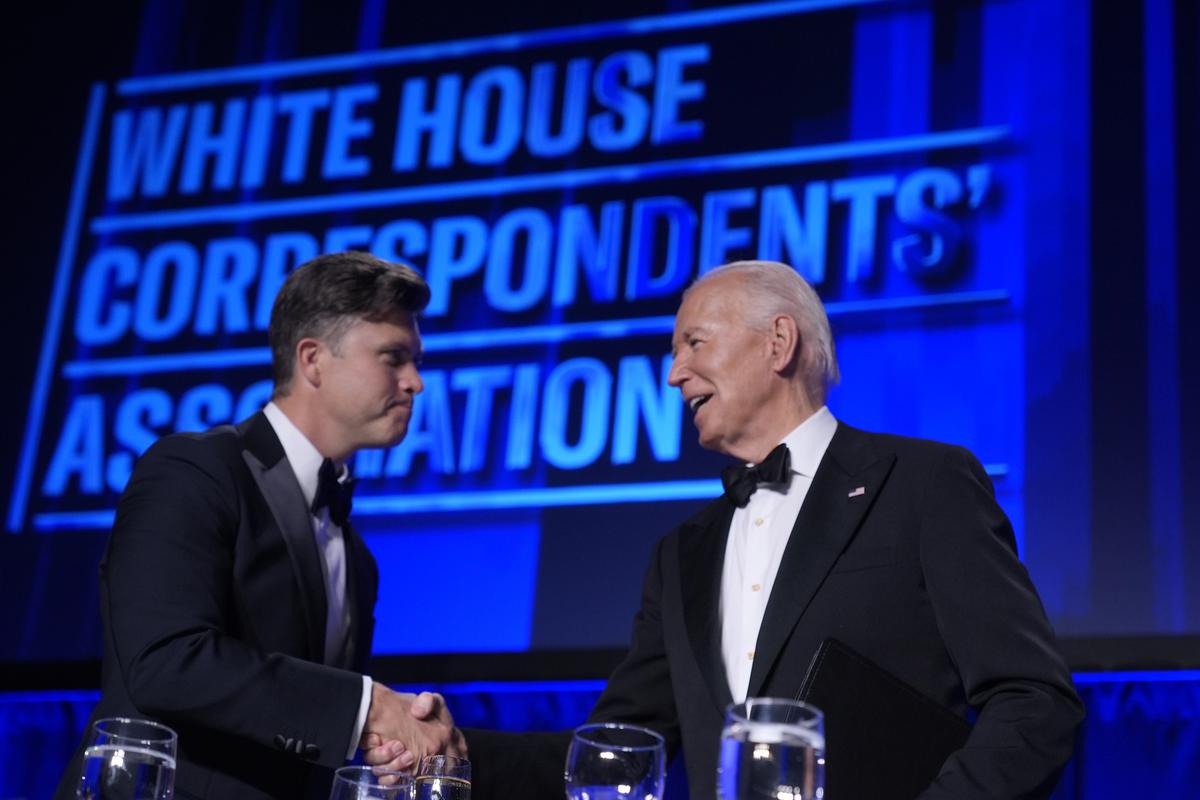 U.S. President Joe Biden talks to Colin Jost, the host of this year’s White House Correspondents’ Association Dinner at the Washington Hilton on April 27, 2024, in Washington. 