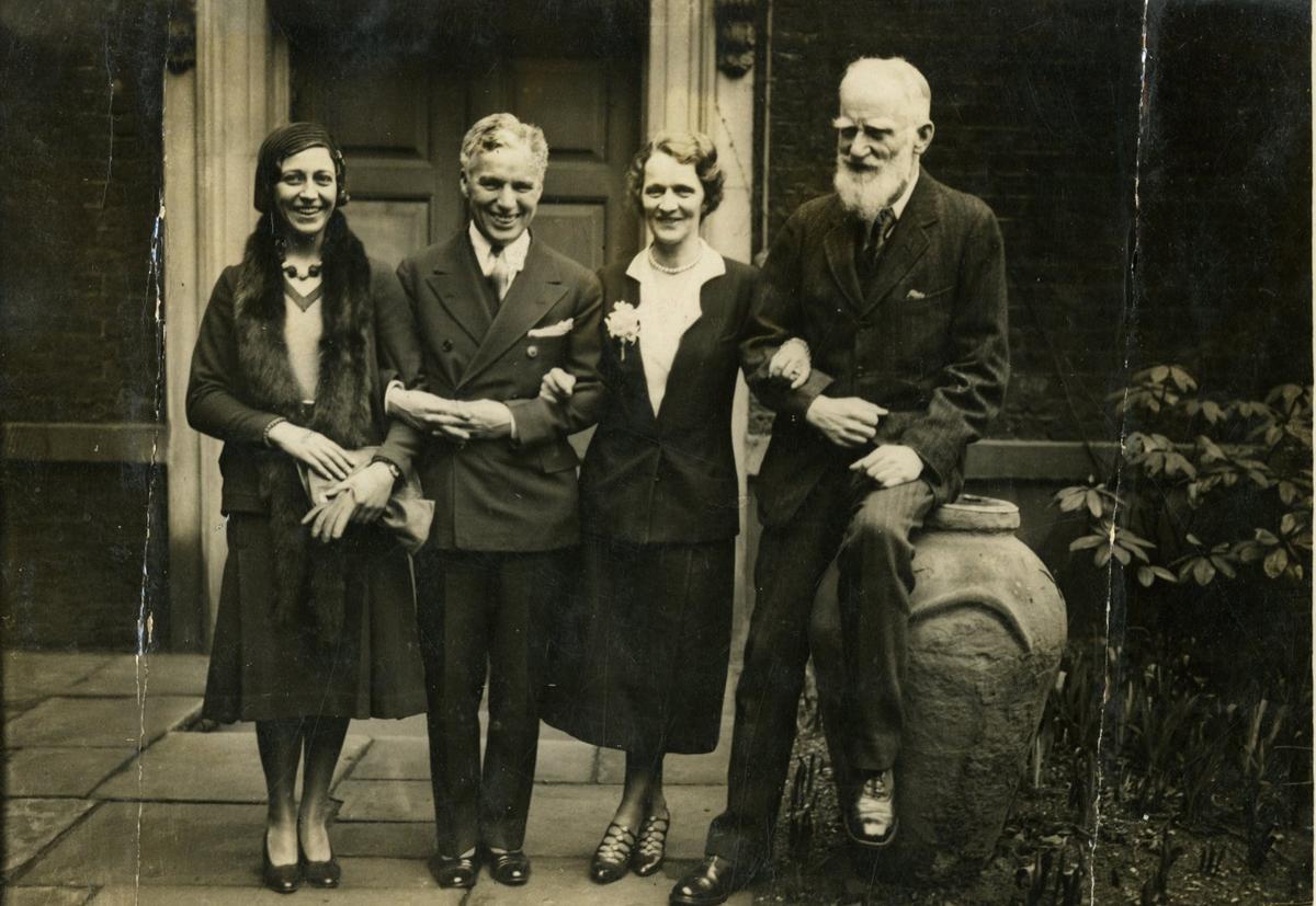 Amy Johnson (left), the famous airwoman, with Charlie Chaplin (second from left), Lady Astor (second from right) and George Bernard Shaw in the garden of Lady Astor’s London residence after a luncheon. Amy Johnson (left), the famous airwoman, with Charlie Chaplin (second from left), Lady Astor (second from right) and George Bernard Shaw in the garden of Lady Astor’s London residence after a luncheon.
