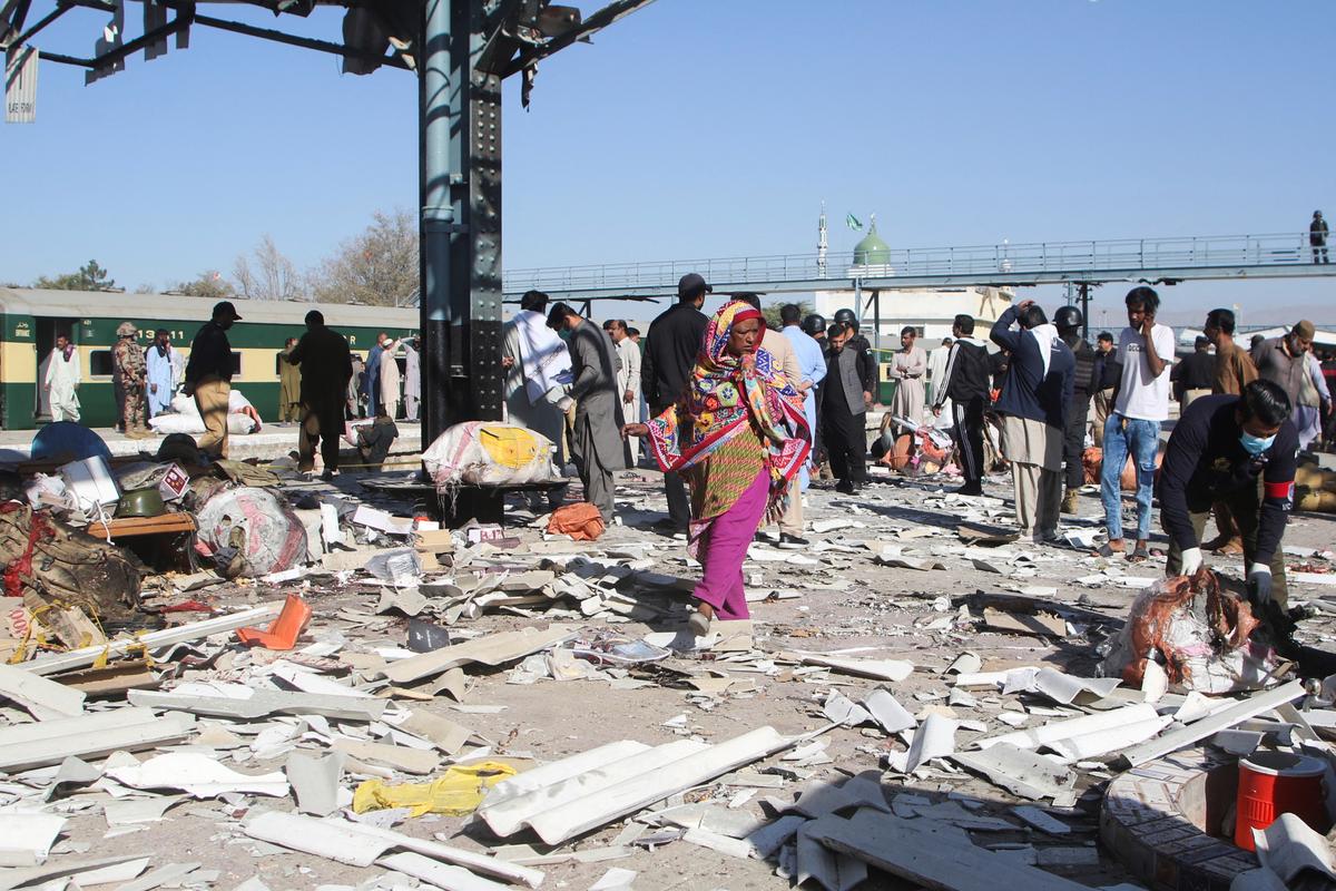 A woman walks amid the debris after a bomb blast at a railway station in Quetta, Pakistan November 9, 2024. 