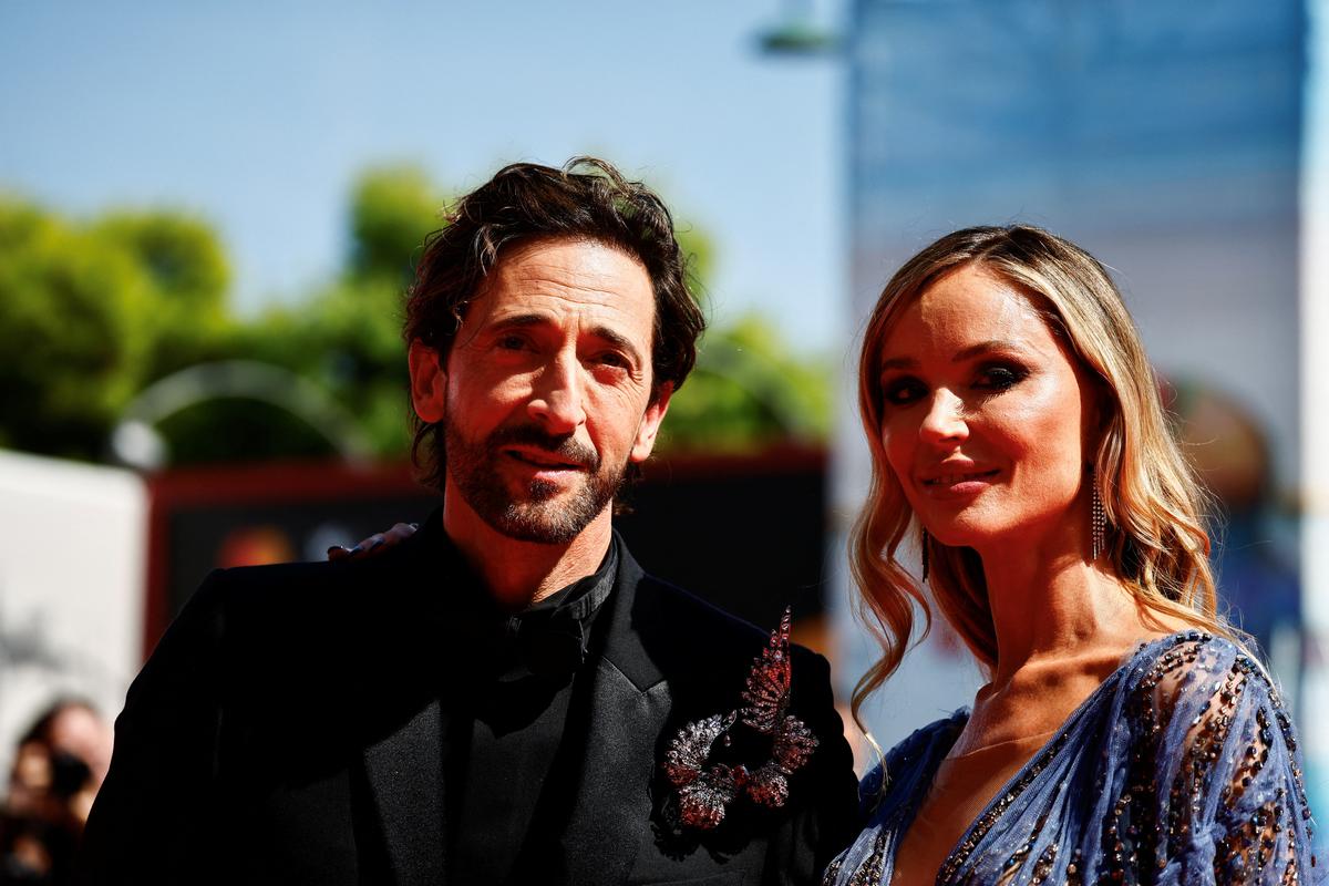 Cast member Adrien Brody and Georgina Chapman pose on the red carpet during arrivals for the screening of the movie ‘The Brutalist’, in competition, at the 81st Venice Film Festival, Venice, Italy, September 1, 2024. 