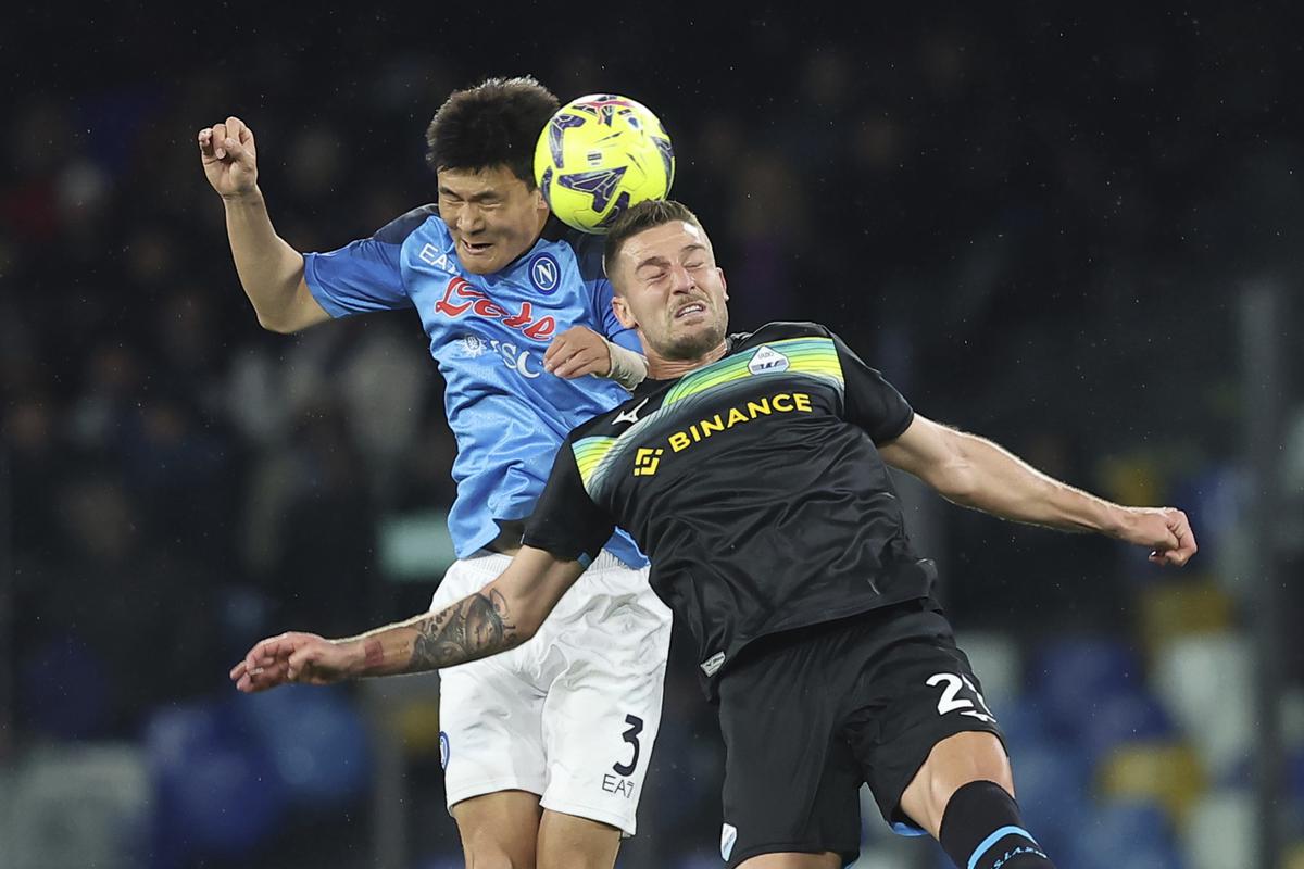 Napoli’s Kim Min-Jae battles for a head ball with Lazio’s Elseid Hysaj during the Serie A soccer match between Napoli and Lazio, at the Diego Armando Maradona stadium in Naples, Italy, Friday, March 3, 2023. 