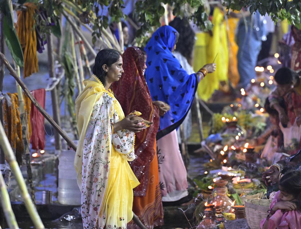 Devotees gather at Bathukamma Ghat, Tank Bund, to offer Sandhya Arghya to the setting sun during Chhath Puja celebrations in Hyderabad on Monday.