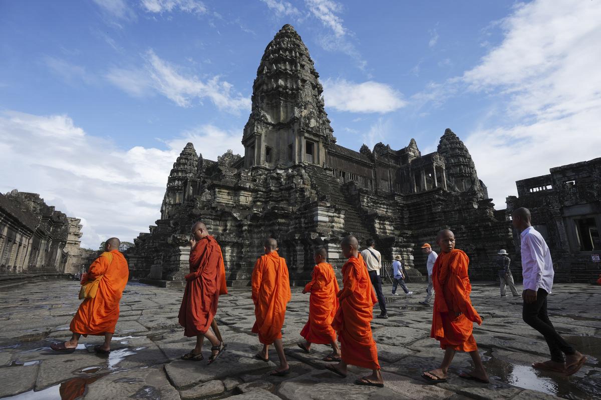 Buddhist monks visit Angkor Wat, in Siem Reap, Cambodia.