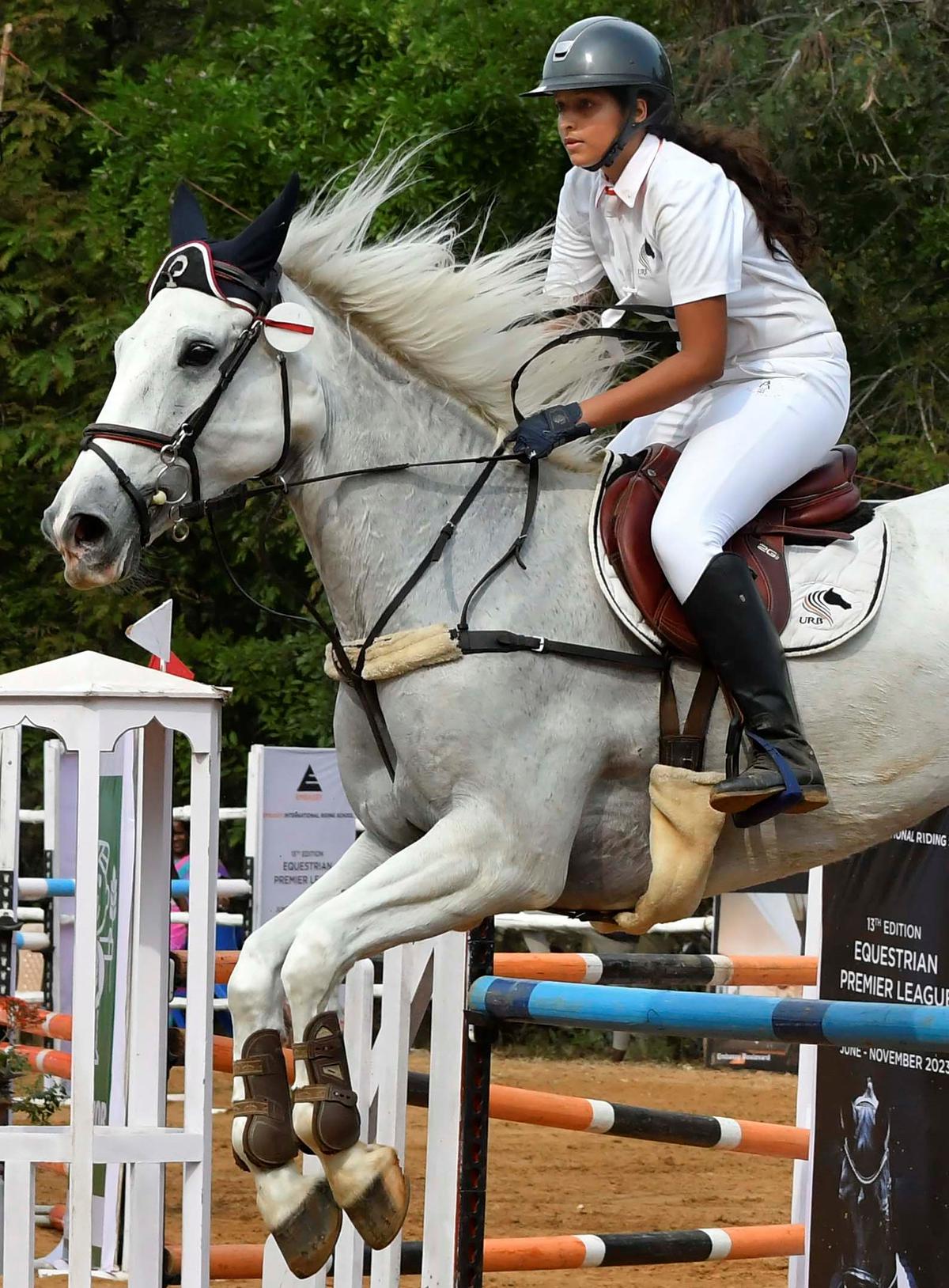 A rider in show jumping (105 cm to 115 cm) at the Auroville Horse Tournament-2023 held at Red Earth Riding School in Auroville on Sunday. 
