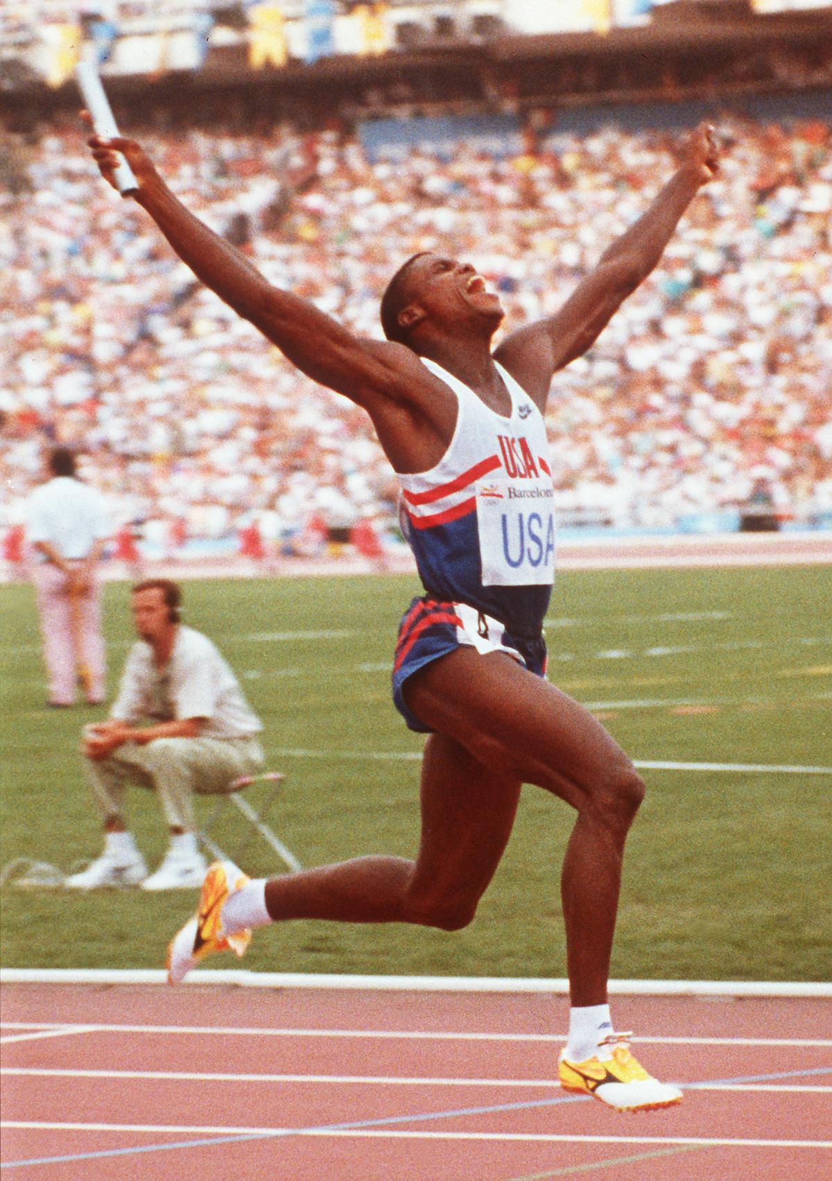 (FILES) Carl Lewis of the US celebrates as he crosses the finish line to win the men's 4x100m relay final at the Olympic Stadium in Barcelona on August 8, 1992. A legend of 20th century track and field, US star athlete Carl Lewis won nine Olympic golds and was eight times crowned world champion. Graceful and instantly recognisable with his million-dollar smile, long legs and crew cut, he sat out the 1980 Moscow Games due to the US Cold War boycott (Photo by Ron KUNTZ / IOPP / AFP) (FILES) Carl Lewis of the US celebrates as he crosses the finish line to win the men's 4x100m relay final at the Olympic Stadium in Barcelona on August 8, 1992. A legend of 20th century track and field, US star athlete Carl Lewis won nine Olympic golds and was eight times crowned world champion. Graceful and instantly recognisable with his million-dollar smile, long legs and crew cut, he sat out the 1980 Moscow Games due to the US Cold War boycott (Photo by Ron KUNTZ / IOPP / AFP)