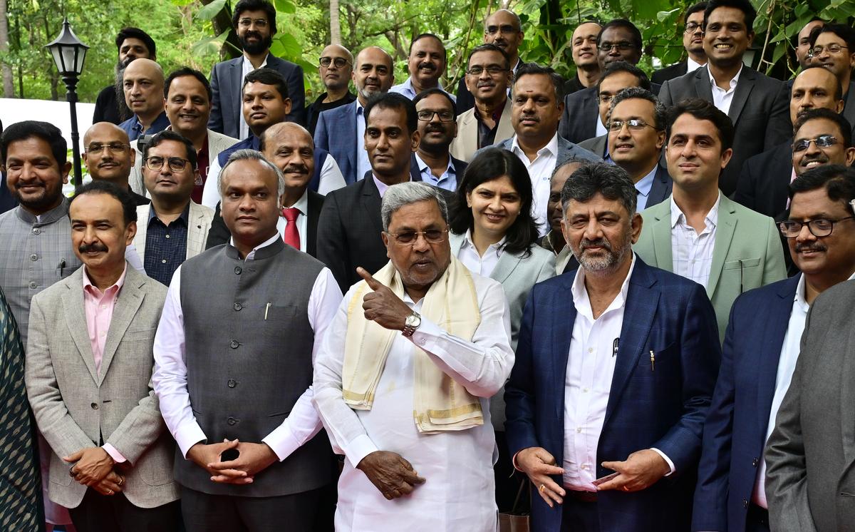 Chief Minister Siddaramaiah, Deputy Chief Minister D.K. Shivakumar, and IT-BT Minister Priyank Kharge pose with the CEOs of the industries ahead of the Bengaluru Tech Summit 2024 in Bengaluru on Friday.