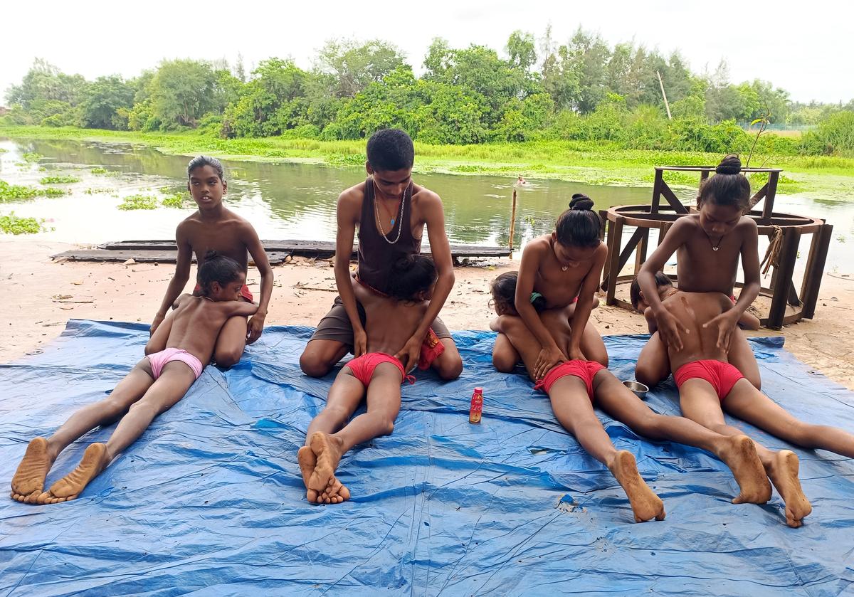 Young Gotipua dancers are being massaged with oil, a routine, at Gurukul at Khajuria village in Odishas Puri district. 