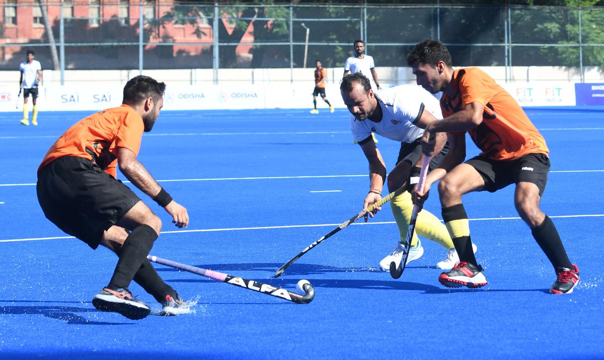 Lalit Kumar Upadhyay, centre, of Uttar Pradesh who scored a goal against Rajasthan during the 13th National Senior Hockey in Chennai on Friday, November 24, 2023.