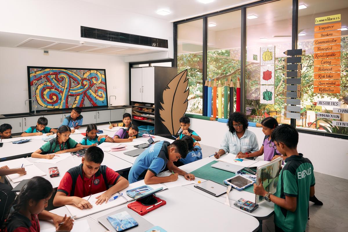 A classroom shaded by green trees.