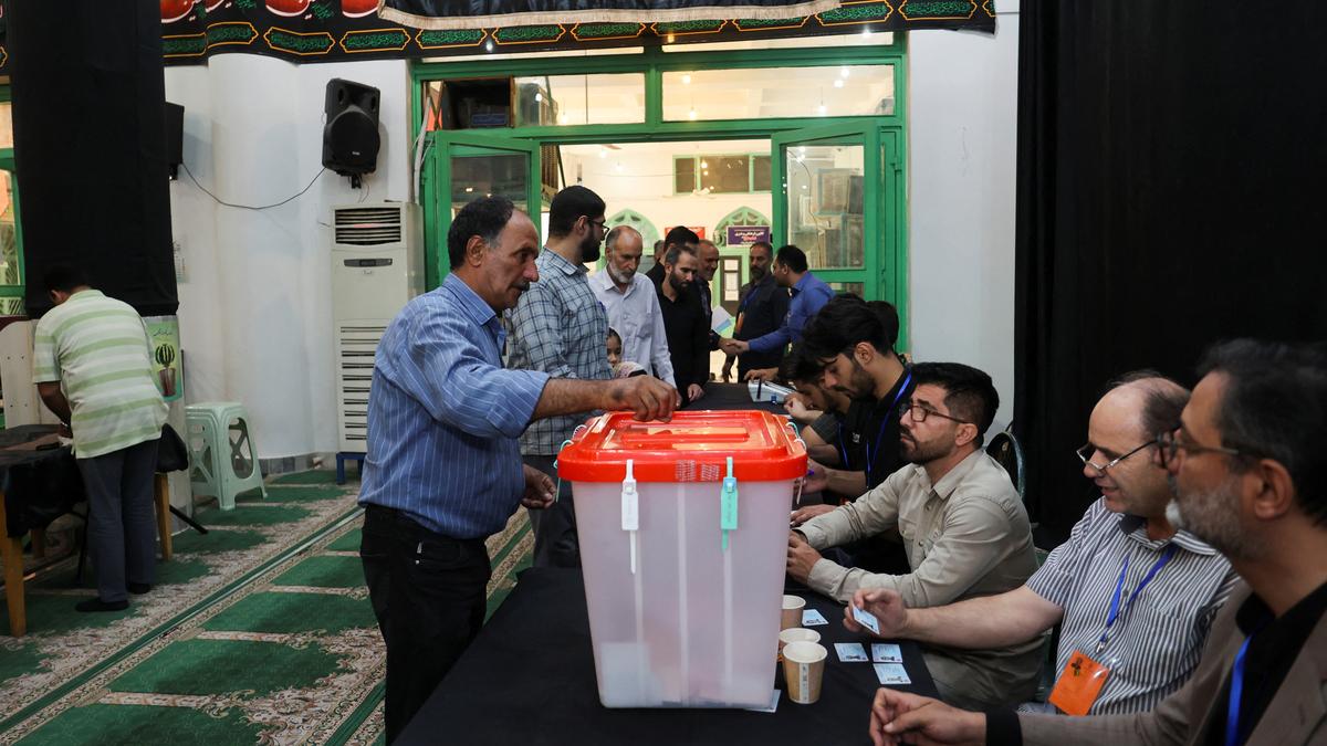 Iran holds runoff presidential vote pitting hard-line former negotiator against reformist lawmaker