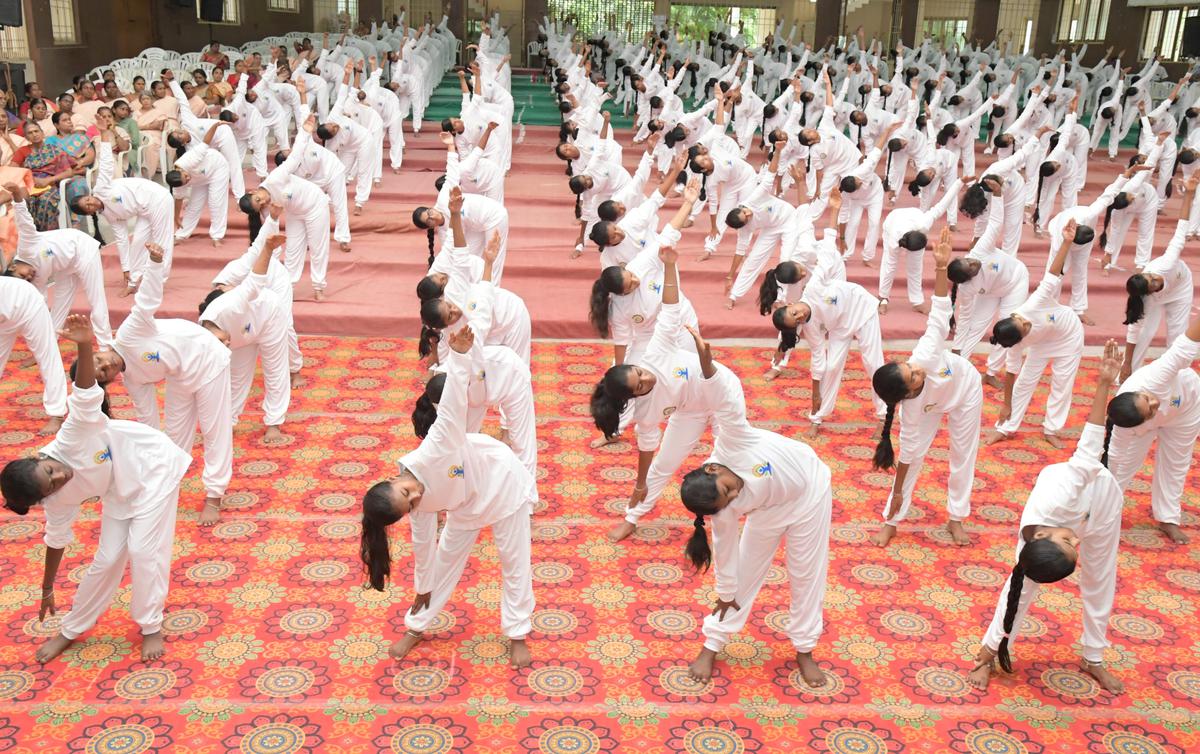 College students performing yoga on the occasion of the International Day of Yoga at Vellalar College for Women at Thindal in Erode in Tamil Nadu on Tuesday.