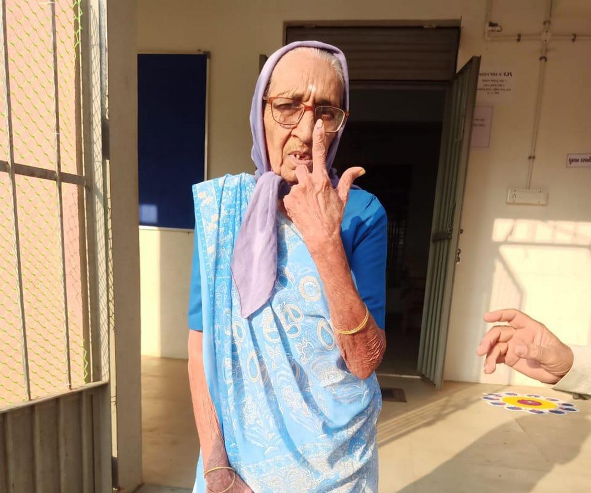 100-year-old Kamuben Lalabhai Patel after casting her vote at Umargam in Valsad district.