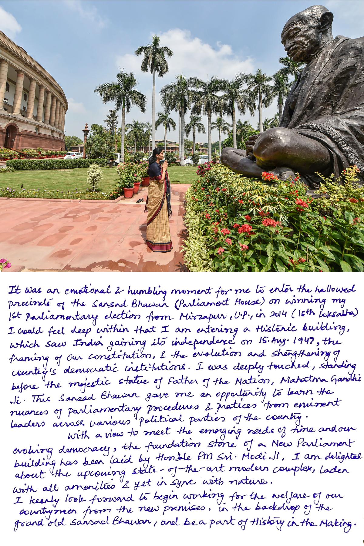 Union Minister of State for Commerce and Industry and Apna Dal (S) MP Anupriya Patel pays homage to Mahatma Gandhi at the old Parliament House in New Delhi, Monday, Aug.  8, 2022. Patel in her hand-written note (below) recalls her memories of the old Parliament House