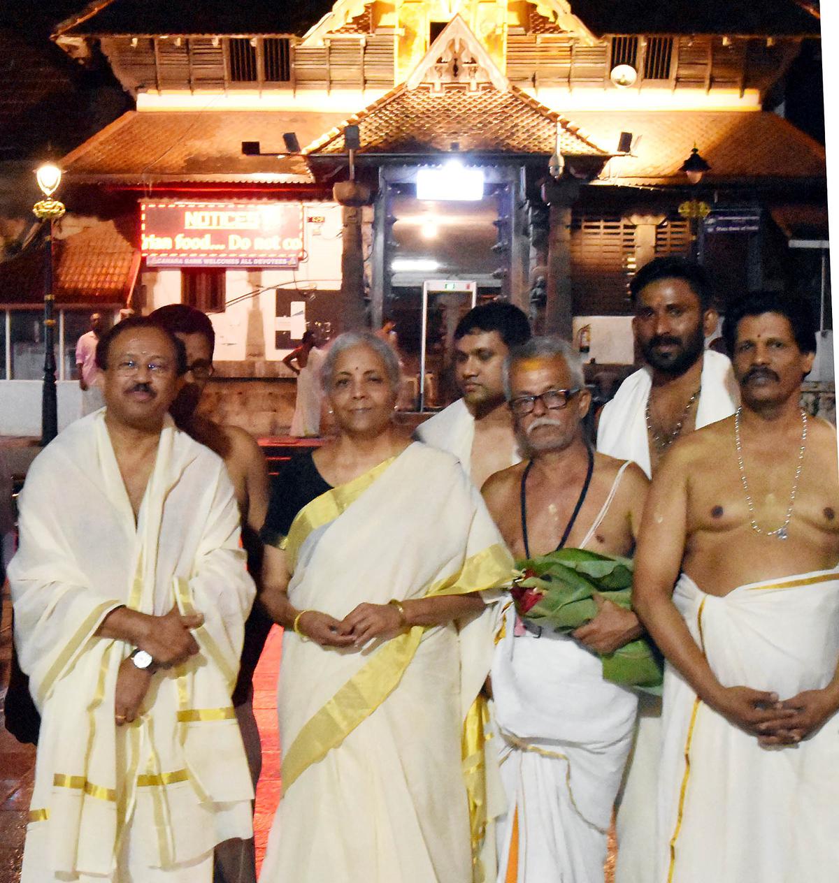 Finance Minister Nirmala Sitharaman, along with Union Minister V Muraleedharan, outside the Sree Padmanabhaswamy temple in Thiruvananthapuram on Saturday.