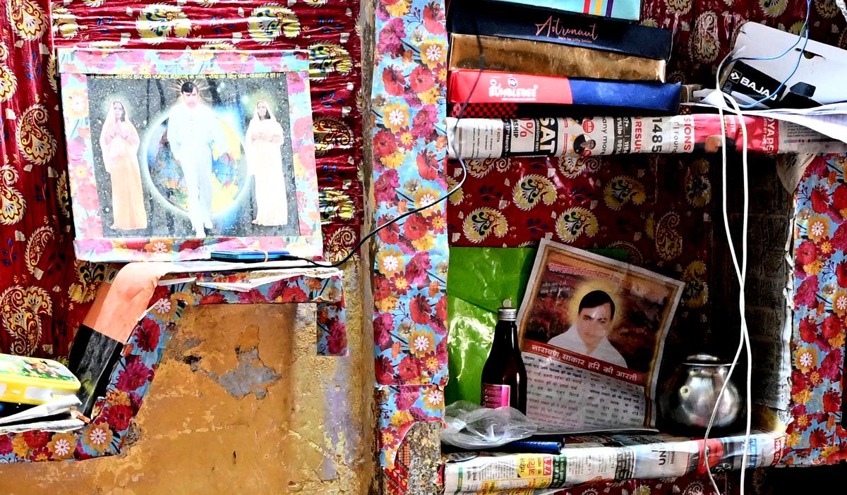 Photographs of the ‘godman’ Suraj Pal at a victim’s house. 